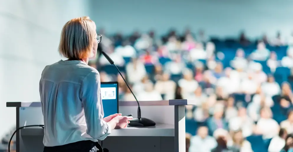 Speaker infront of a large crowd